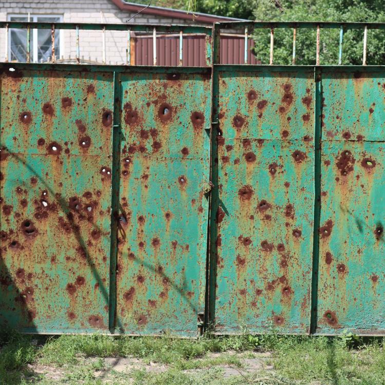 Gate of a house damaged during shelling in Mariinka, Donetsk region